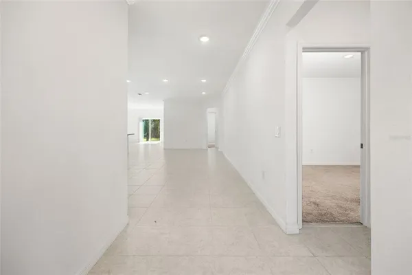 a bathroom with a granite countertop toilet sink and mirror