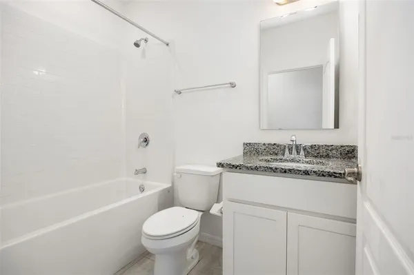 a view of a kitchen with a sink and a large window