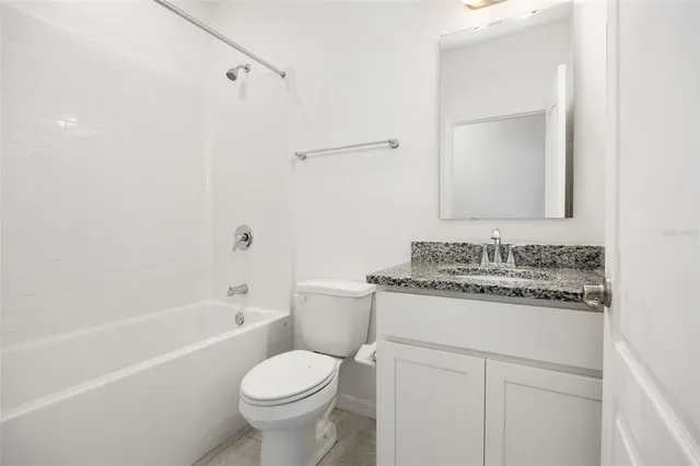 a view of a kitchen with a sink and a large window