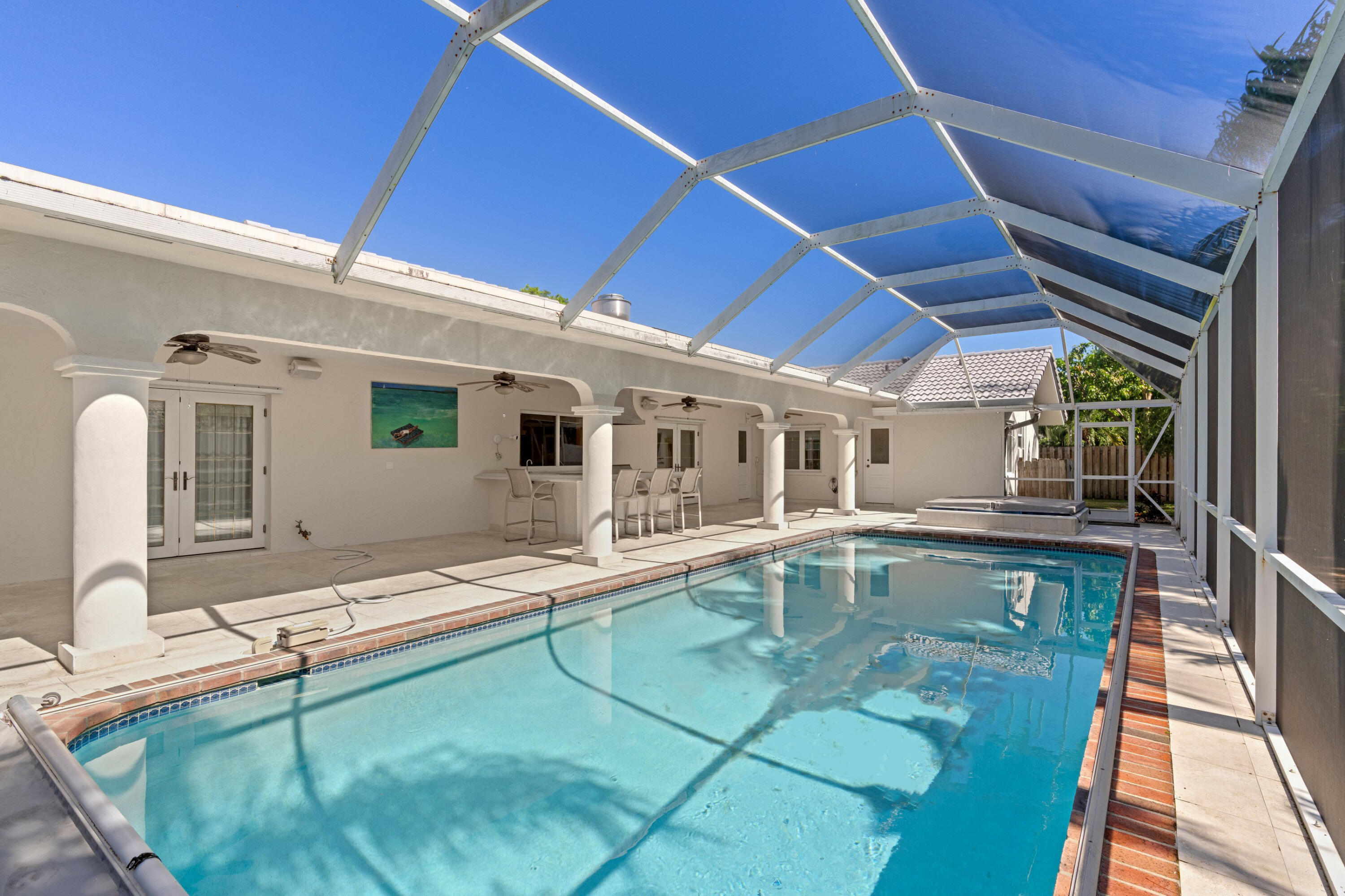 620 Southwest 17th Street Boca Raton, FL 33486 - Photo 16 of 40 a outdoor patio with swimming pool table and chairs
