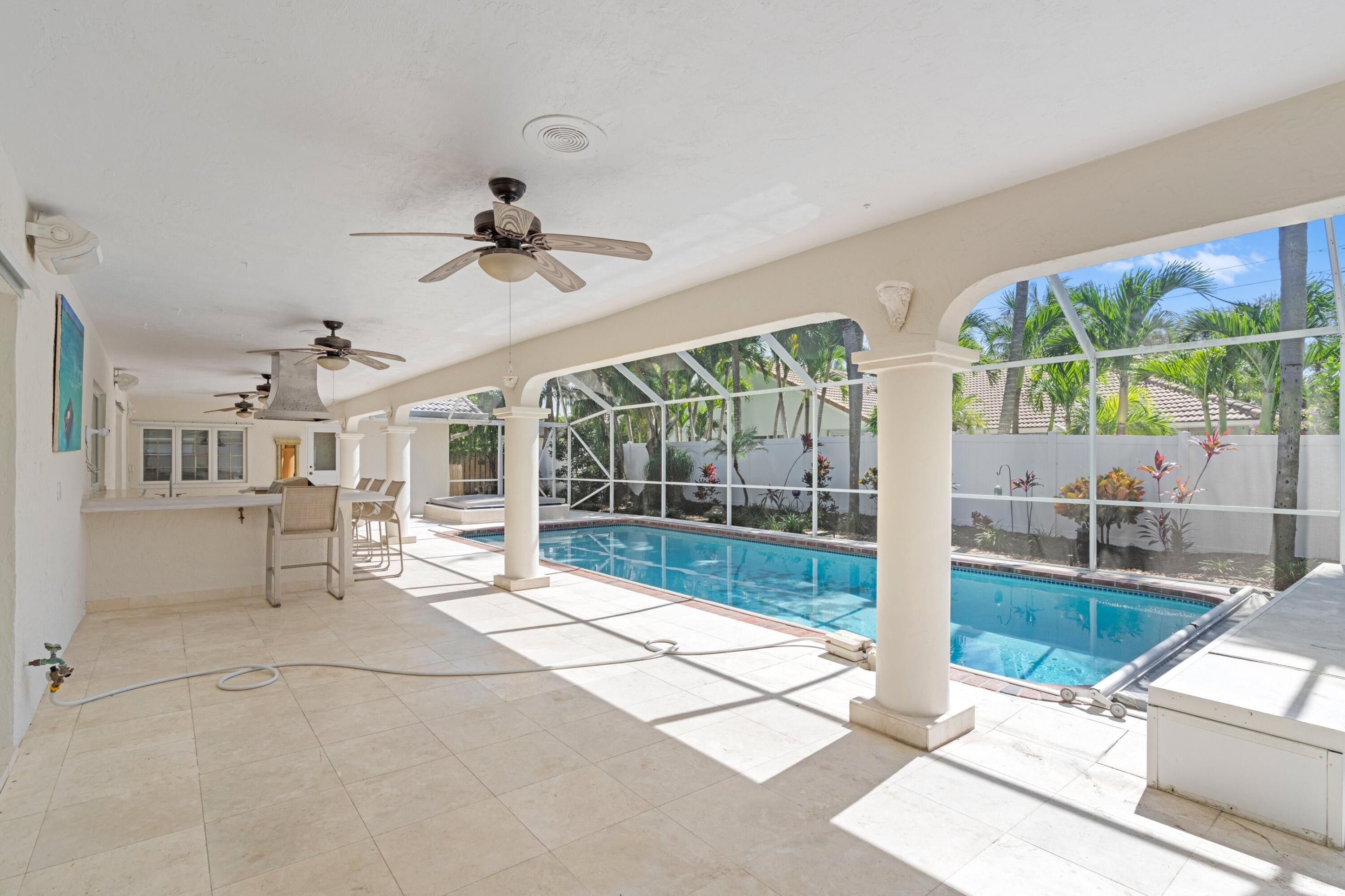 620 Southwest 17th Street Boca Raton, FL 33486 - Photo 17 of 40 a living room with furniture and a floor to ceiling window