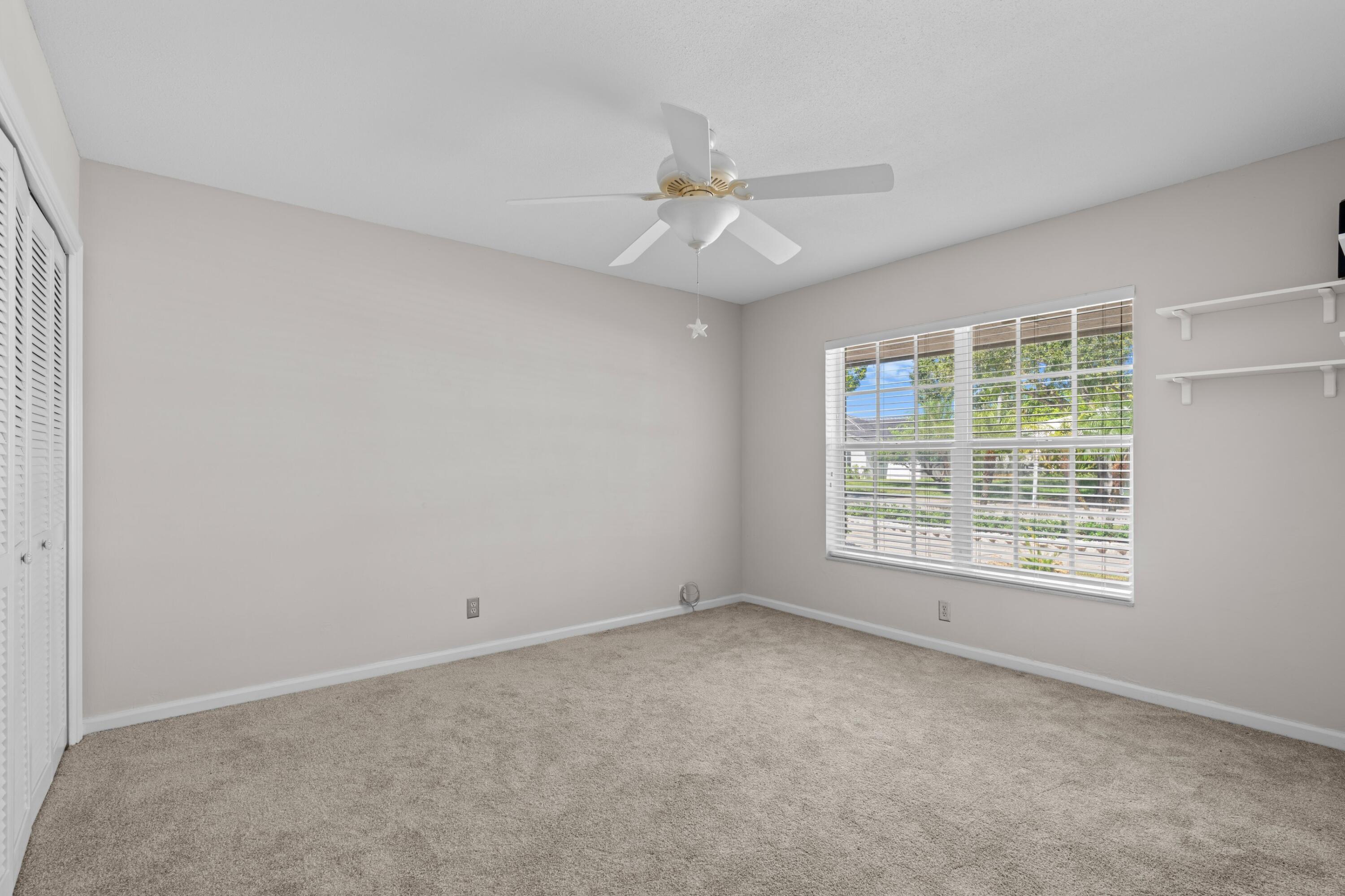 620 Southwest 17th Street Boca Raton, FL 33486 - Photo 20 of 40 an empty room with a window and a fan