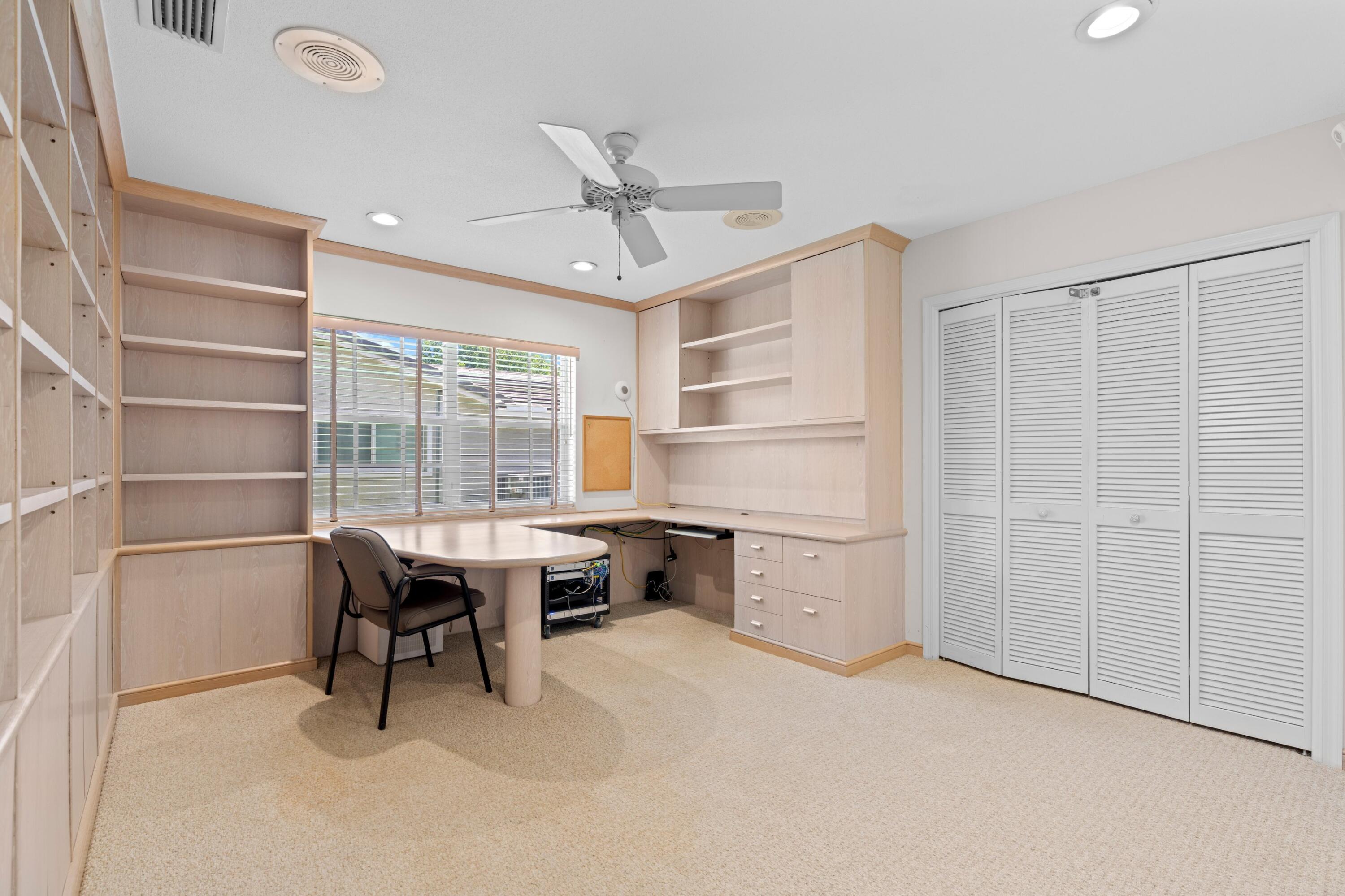 620 Southwest 17th Street Boca Raton, FL 33486 - Photo 22 of 40 a view of a workspace with furniture and a window