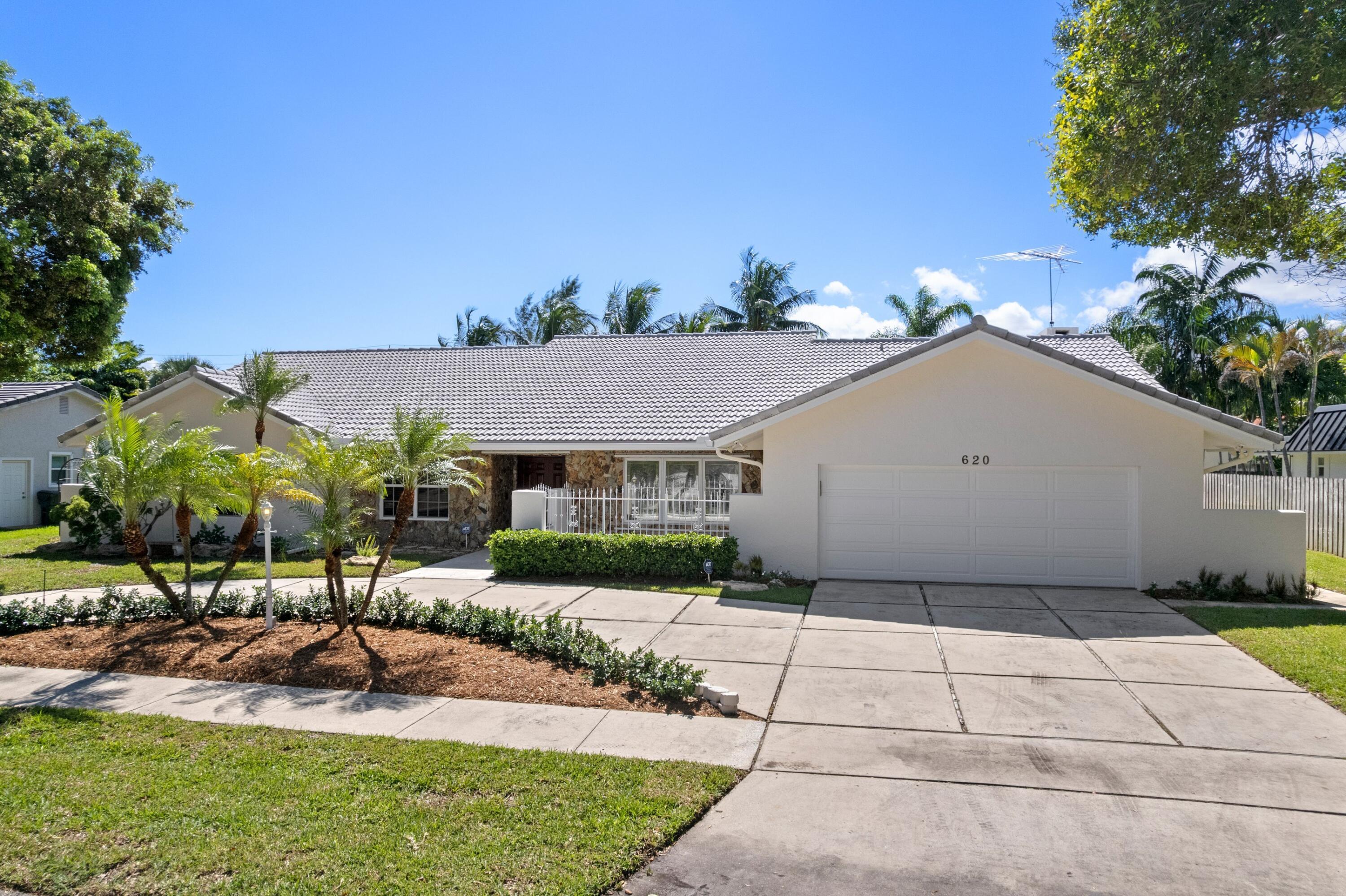 620 Southwest 17th Street Boca Raton, FL 33486 - Photo 24 of 40 a house view with a garden space