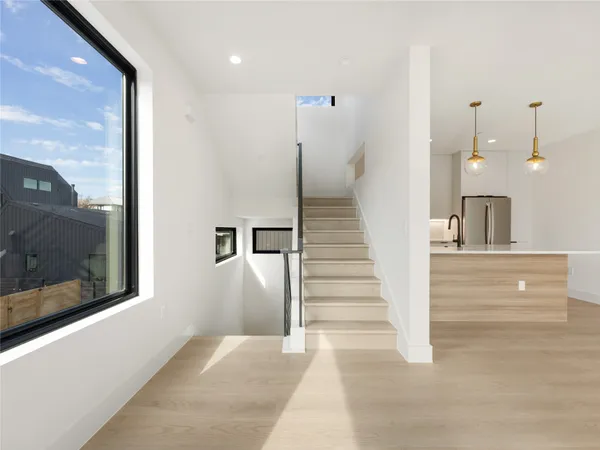 a view of a hallway with staircase