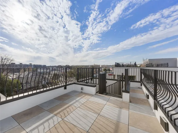 a view of balcony with furniture