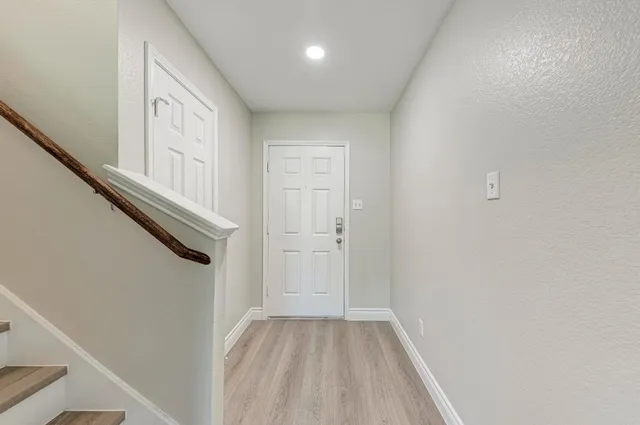 a view of a hallway with entryway