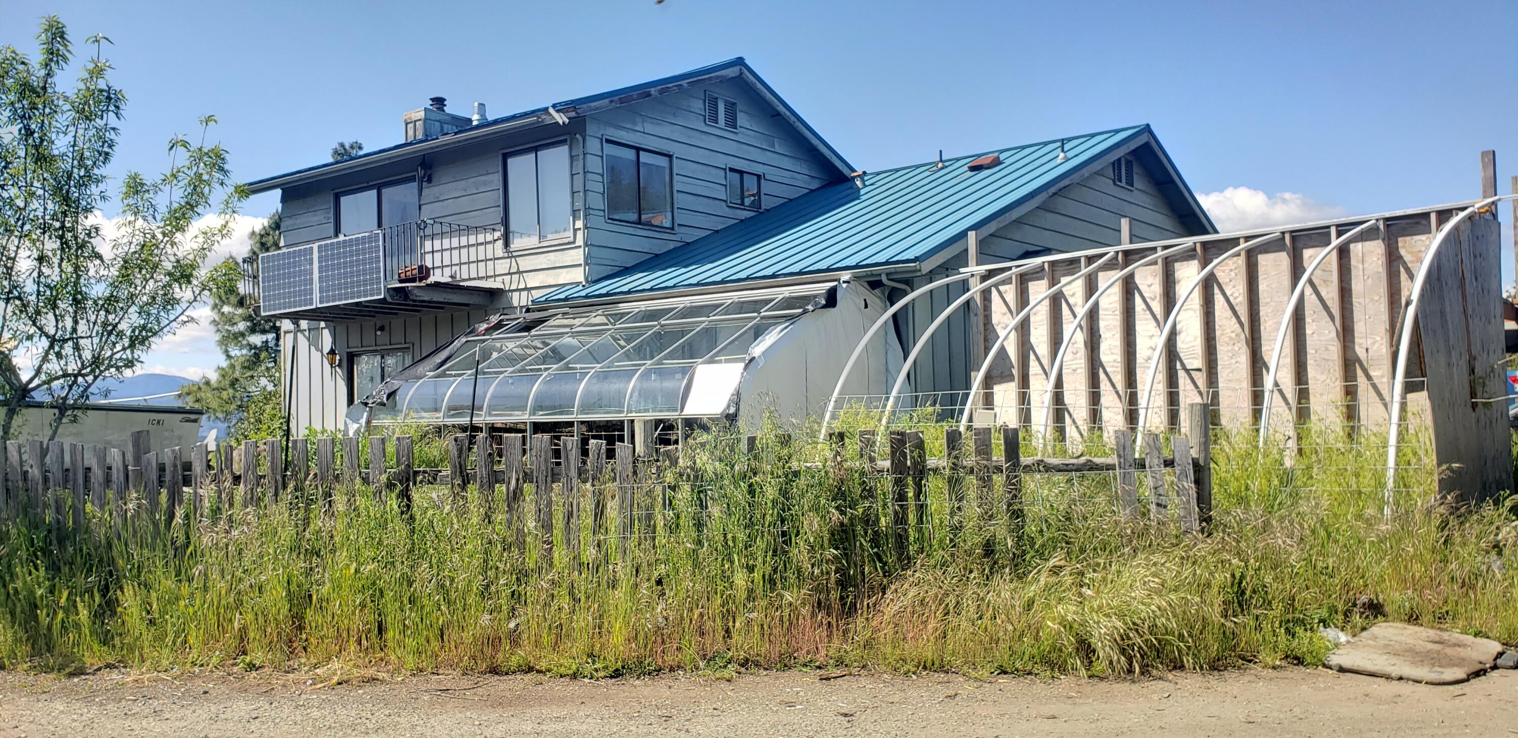 1020 Kirkham Road Cave Junction, OR 97523 - Photo 11 of 16 Solarium on South East side of home, off the kitchen.