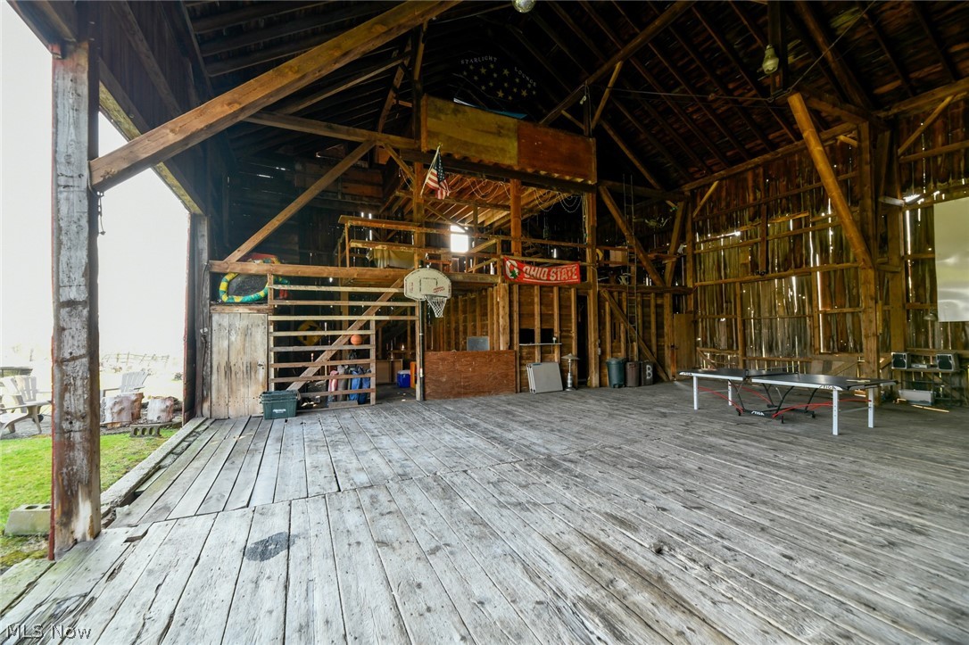 7608 Seasons Road Kent, OH 44240 - Photo 29 of 35 With a huge amount of floor space, two more levels above this one, this is a great place for housing animals or entertaining large crowds. The pool table on one of the upper levels can stay. This had been a dairy farm. So the huge space in the lower portion is also a huge space.