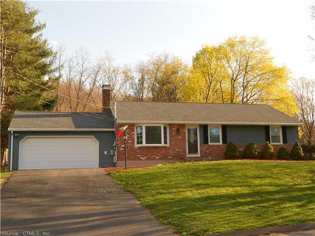 1167 Tucker Road Cheshire, CT 06410 - Photo 1 of 1 a front view of house with yard and trees around