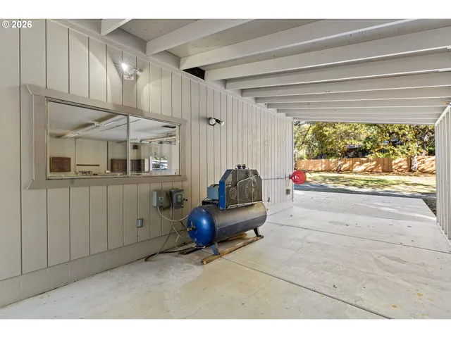 a bathroom with a granite countertop sink mirror vanity and toilet
