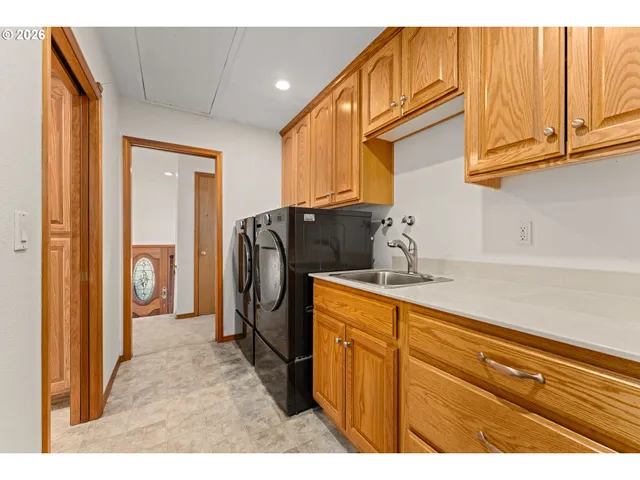 a kitchen with stainless steel appliances granite countertop a refrigerator and cabinets