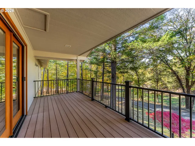 a view of balcony with wooden floor