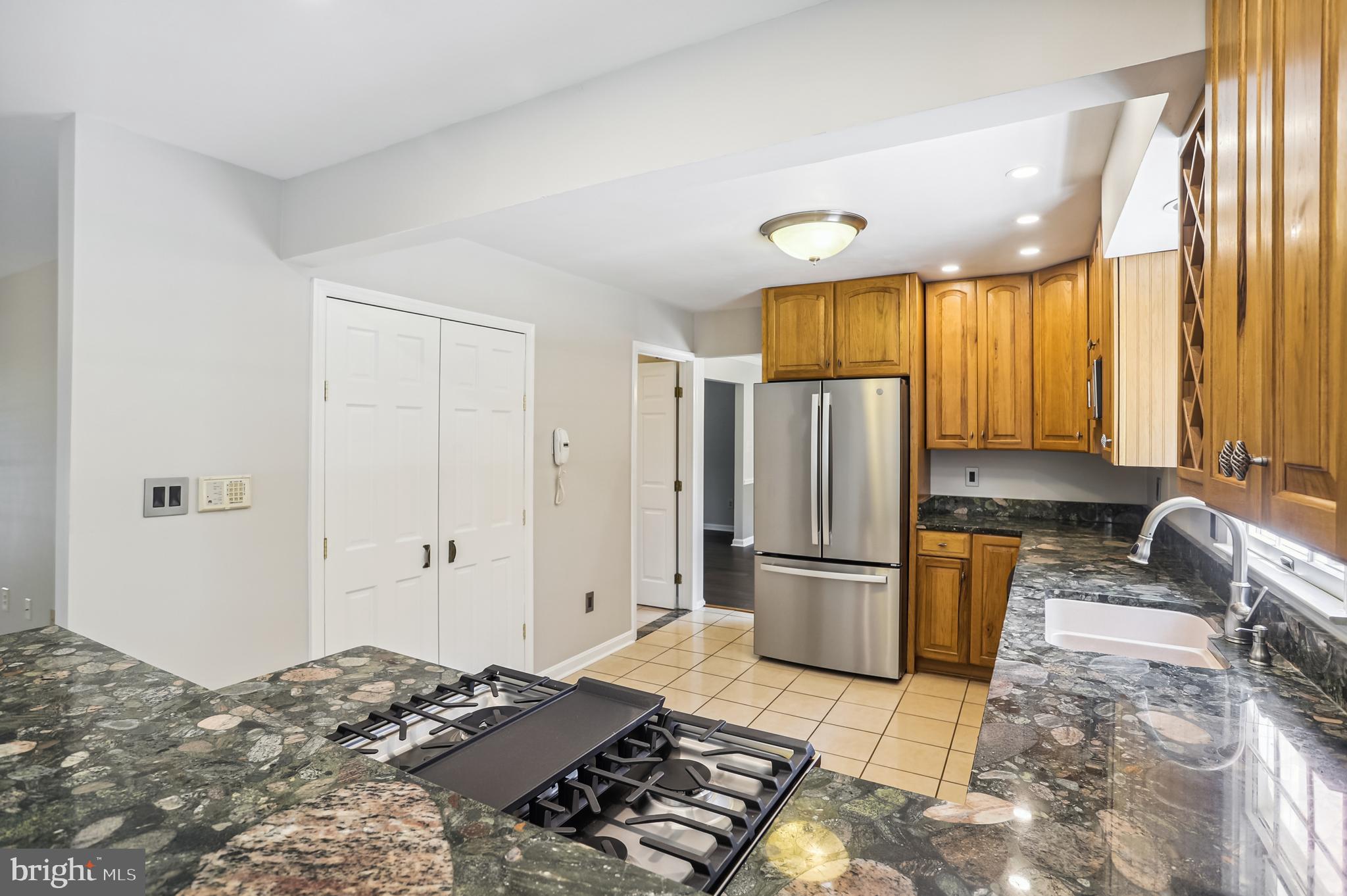735 Evergreen Road Severn, MD 21144 - Photo 12 of 47 a bedroom with a bed and wooden floor