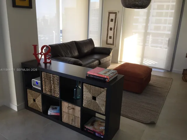 a living room with furniture and a window