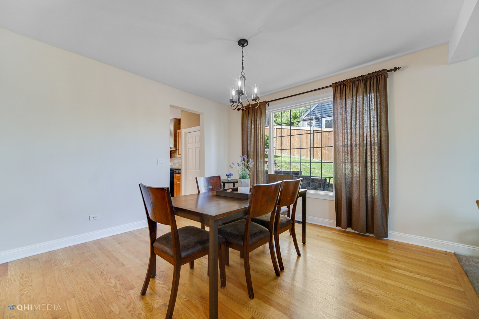 5213 Hayes Road Algonquin, IL 60102 - Photo 15 of 36 a view of a dining room with furniture window and wooden floor