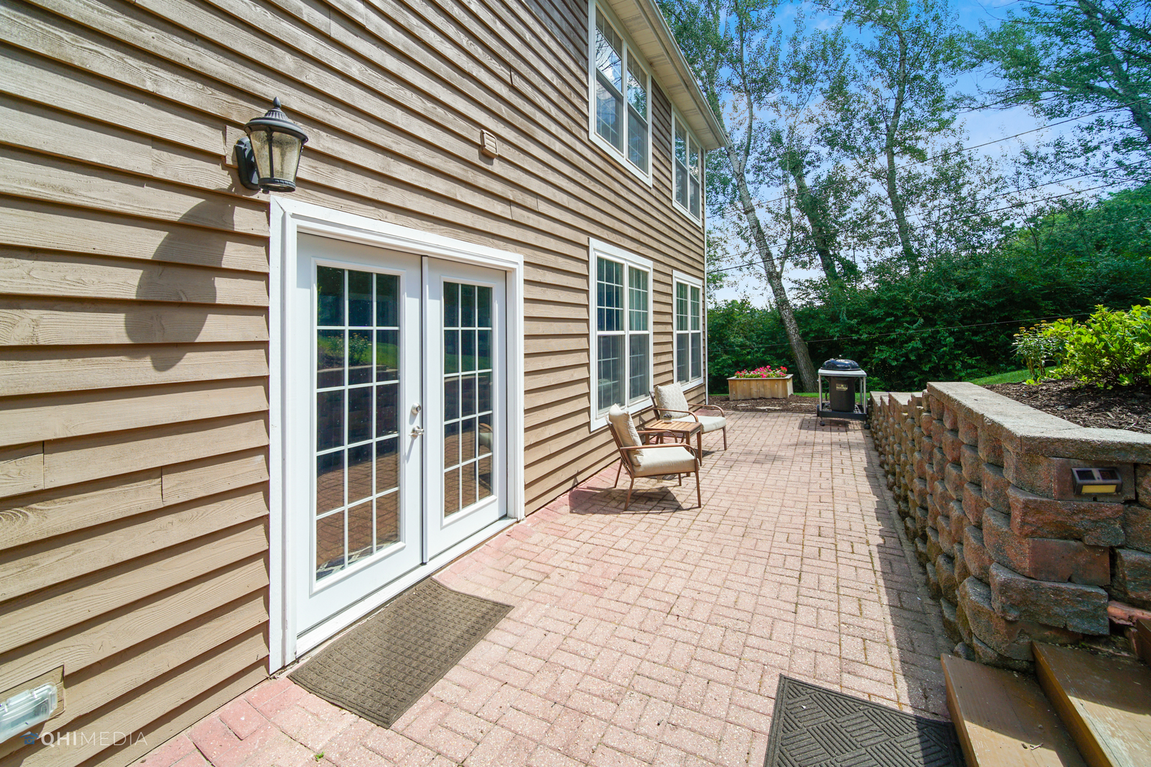5213 Hayes Road Algonquin, IL 60102 - Photo 29 of 36 a view of a patio with table and chairs with wooden floor and fence