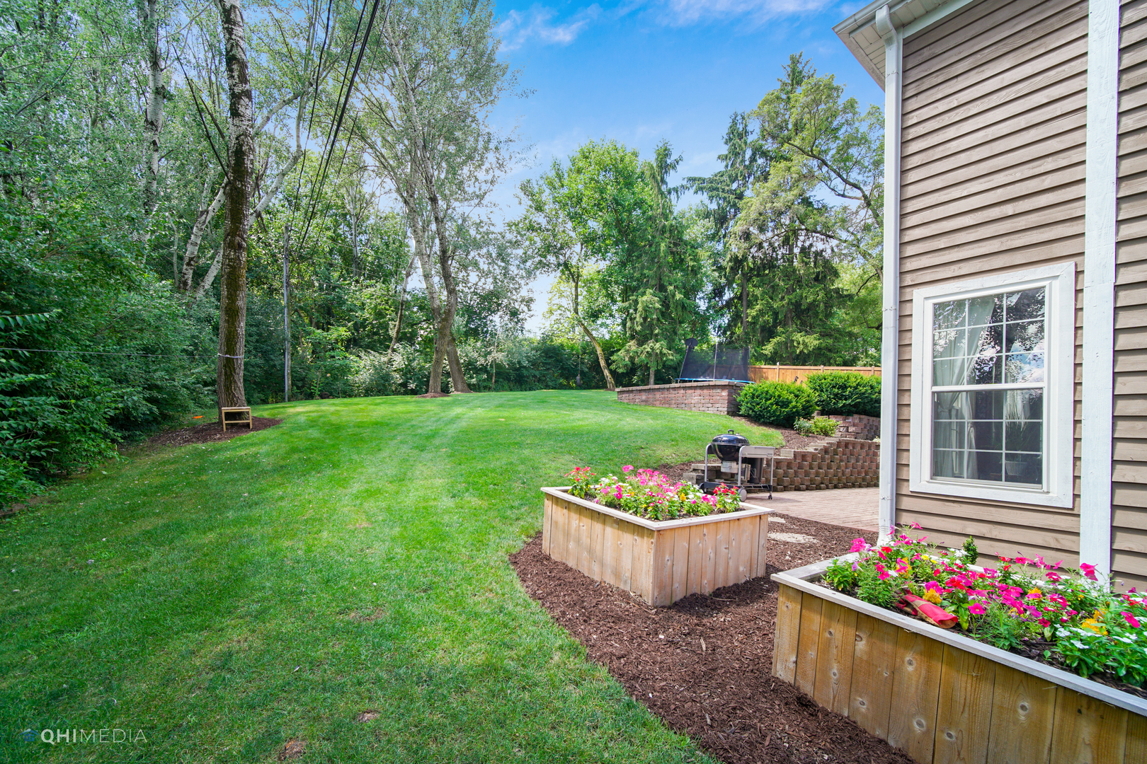5213 Hayes Road Algonquin, IL 60102 - Photo 31 of 36 a garden with flowers and barbeque oven