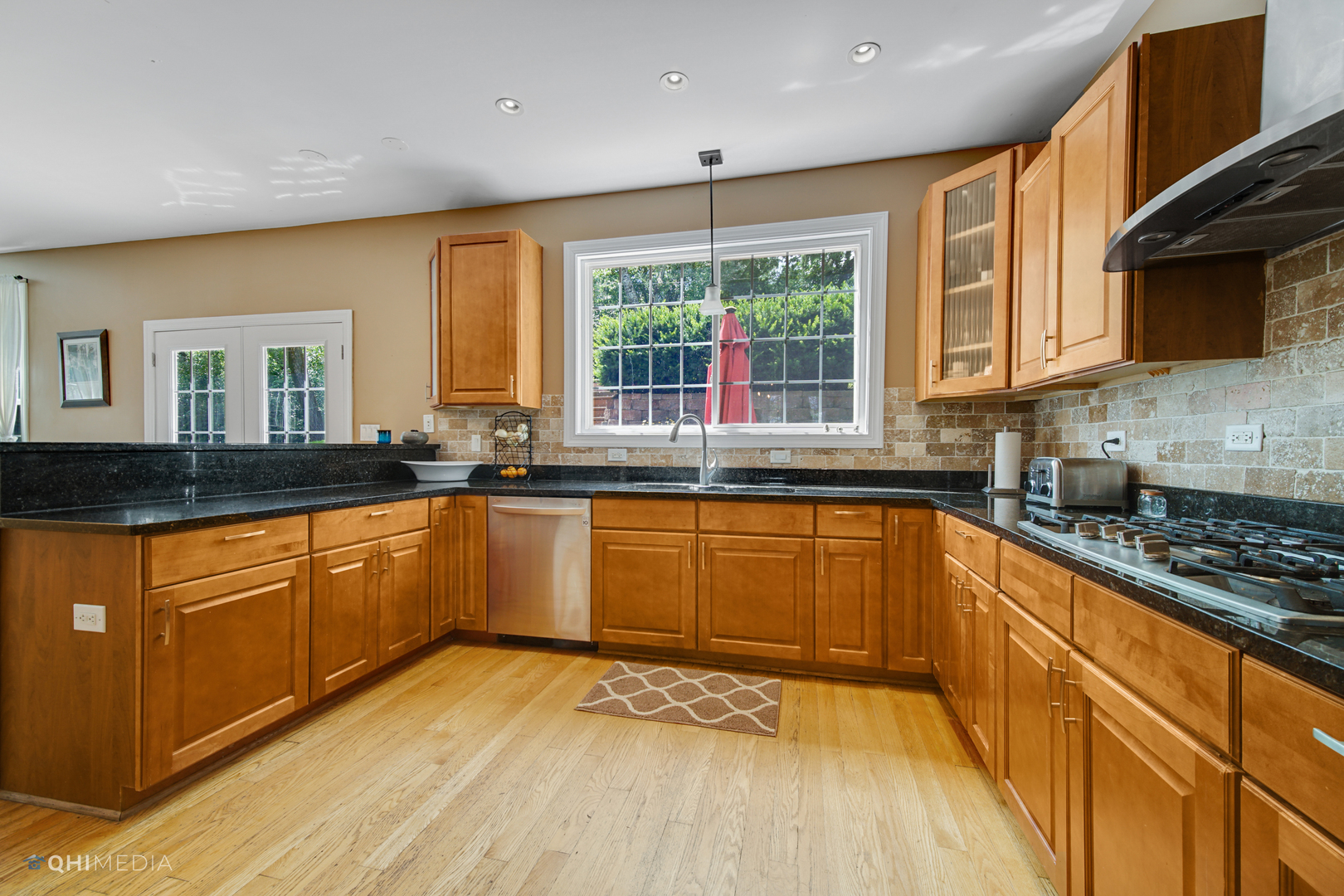 5213 Hayes Road Algonquin, IL 60102 - Photo 6 of 36 a kitchen with stainless steel appliances granite countertop a stove a sink and a granite counter tops