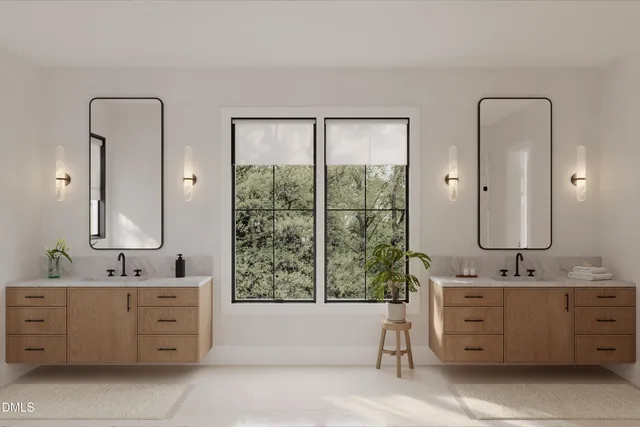 a bathroom with a double vanity sink a mirror and a bathtub