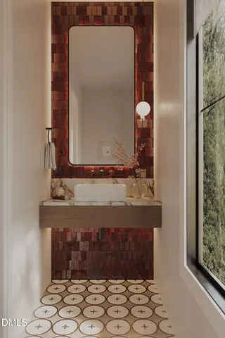a bathroom with a mirror and a sink