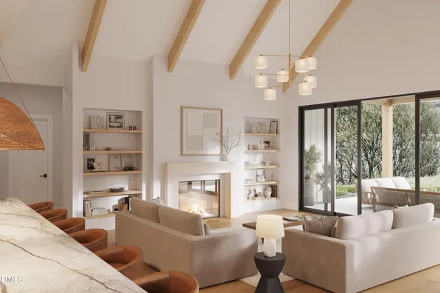 a living room with fireplace furniture and a large window