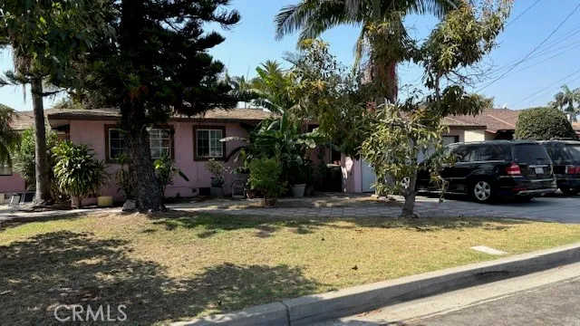 a view of a house with snow on the side of the road