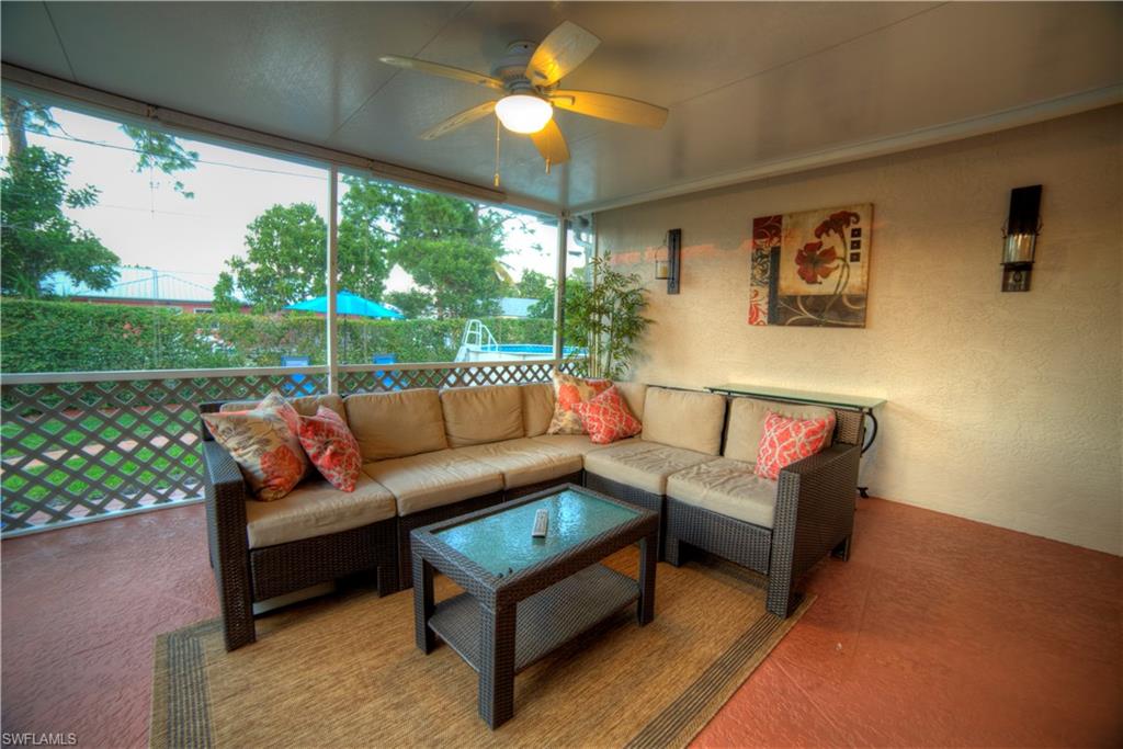 9143 Irving Road Fort Myers, FL 33967 - Photo 10 of 14 a outdoor living space with furniture and garden view