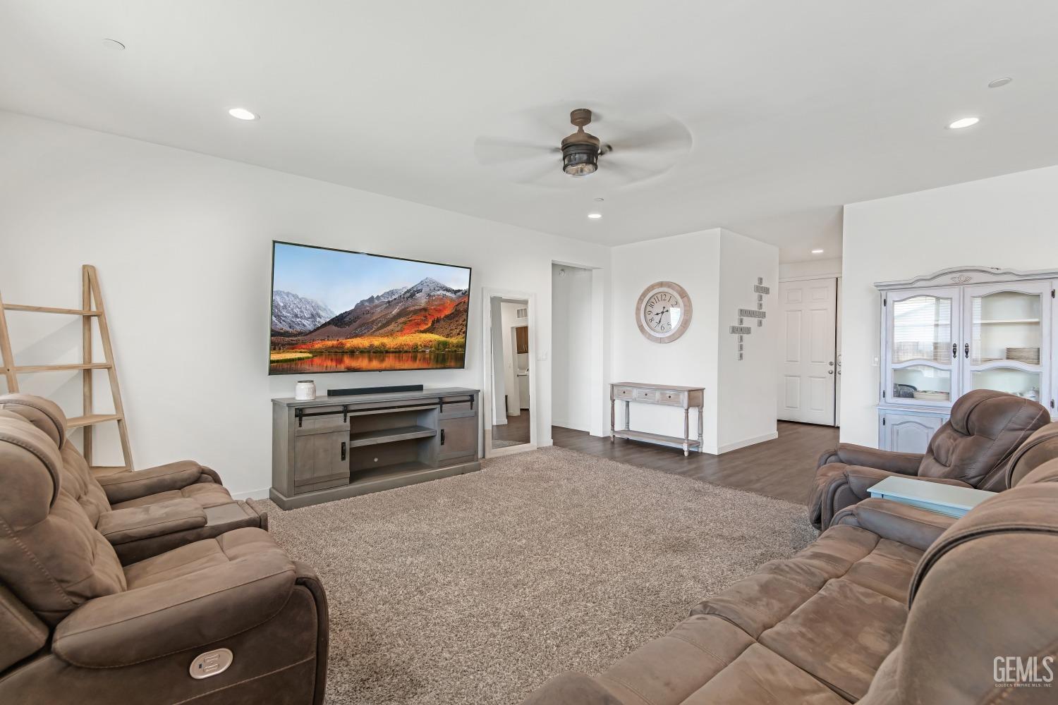 Undisclosed Address Bakersfield, CA 93313 - Photo 14 of 45 a living room with furniture and a flat screen tv