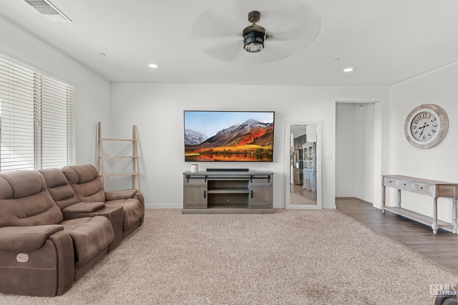 Undisclosed Address Bakersfield, CA 93313 - Photo 15 of 45 a living room with furniture and a flat screen tv