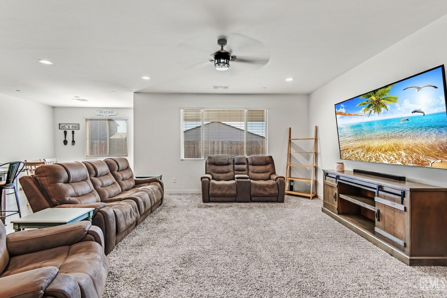 Undisclosed Address Bakersfield, CA 93313 - Photo 17 of 45 a living room with furniture and a flat screen tv