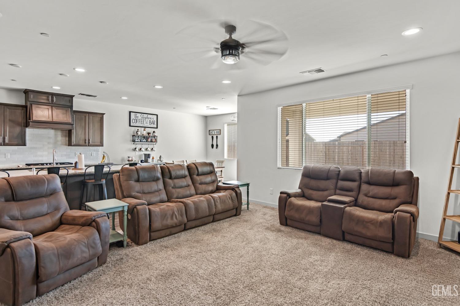 Undisclosed Address Bakersfield, CA 93313 - Photo 18 of 45 a living room with furniture and a large window