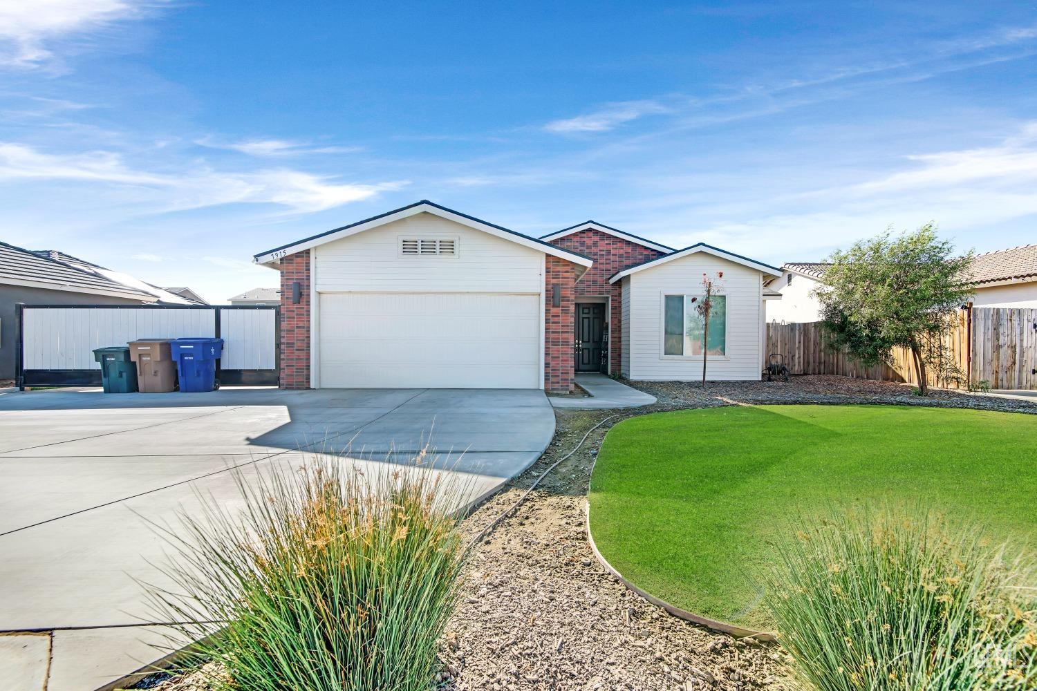 Undisclosed Address Bakersfield, CA 93313 - Photo 2 of 45 a view of a house with a yard