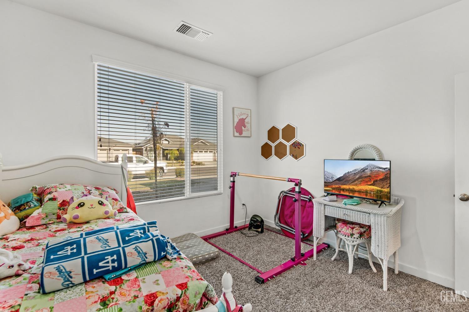 Undisclosed Address Bakersfield, CA 93313 - Photo 22 of 45 a bedroom with baby toys and a couch