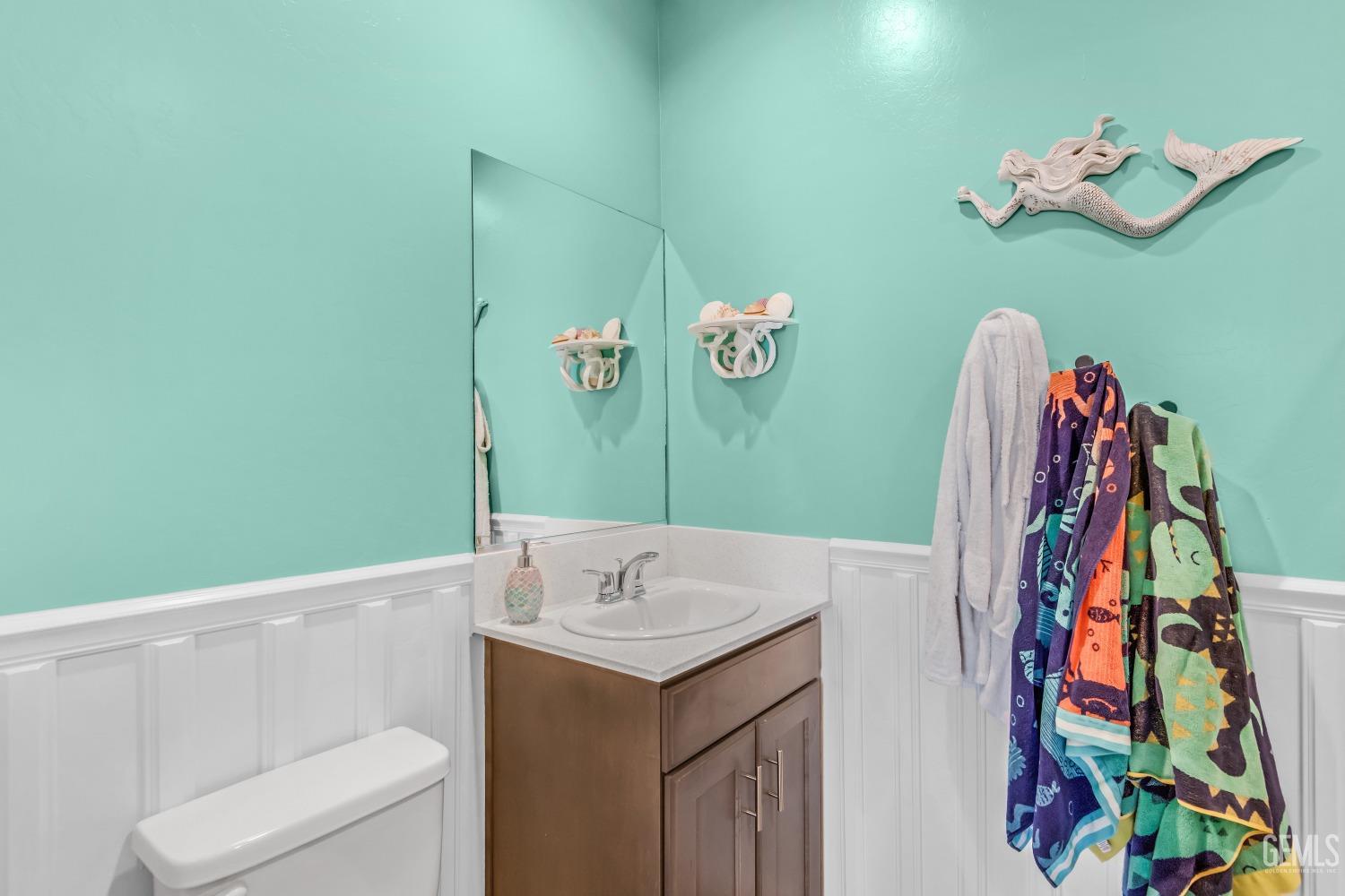 Undisclosed Address Bakersfield, CA 93313 - Photo 23 of 45 a bathroom with a sink mirror and vanity