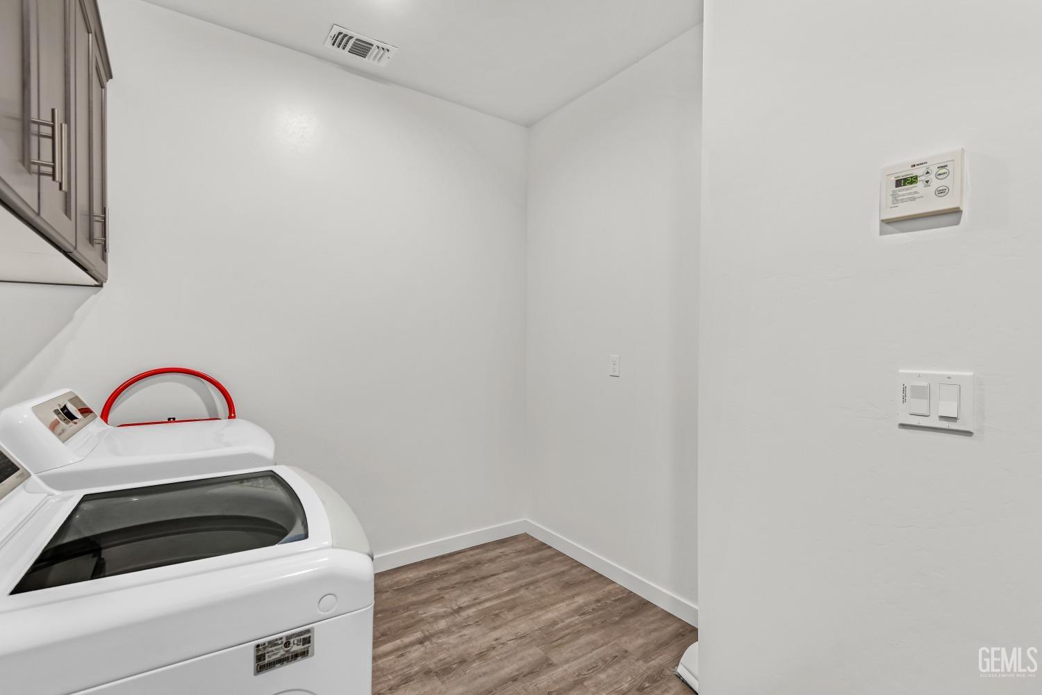 Undisclosed Address Bakersfield, CA 93313 - Photo 31 of 45 a view of utility room with washer and dryer