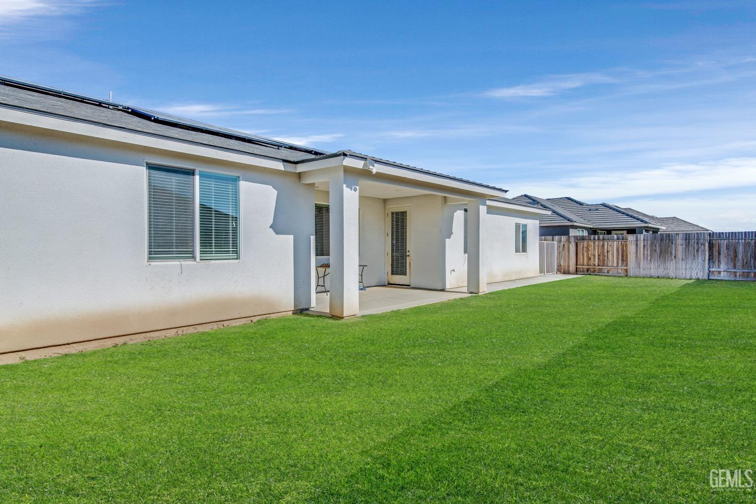 Undisclosed Address Bakersfield, CA 93313 - Photo 37 of 45 a view of a house with a backyard