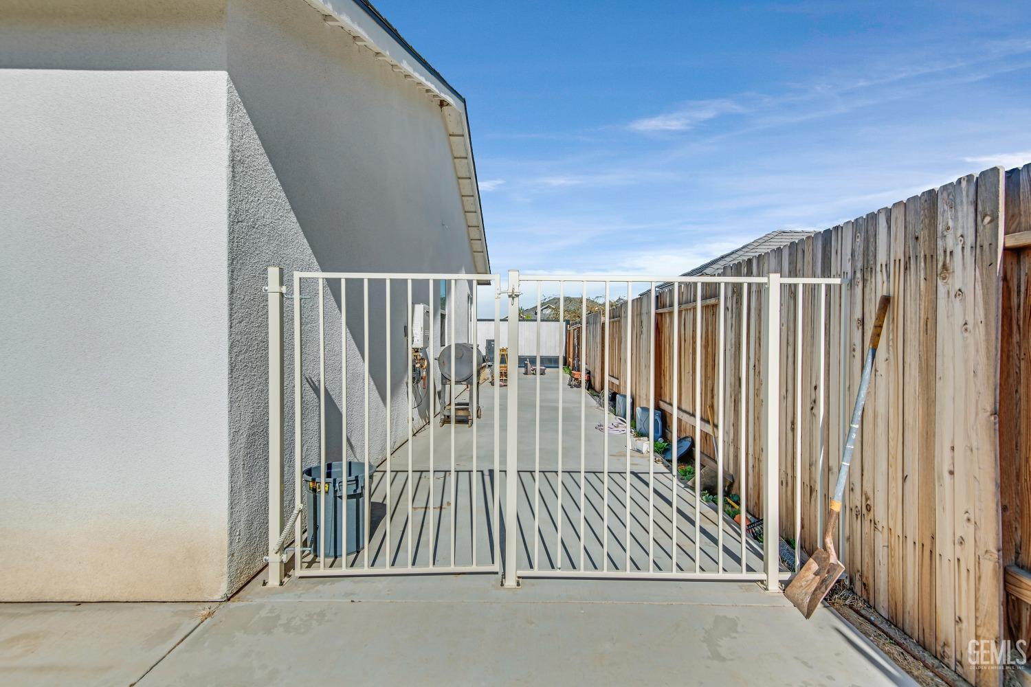 Undisclosed Address Bakersfield, CA 93313 - Photo 40 of 45 a view of staircase with railing and white walls