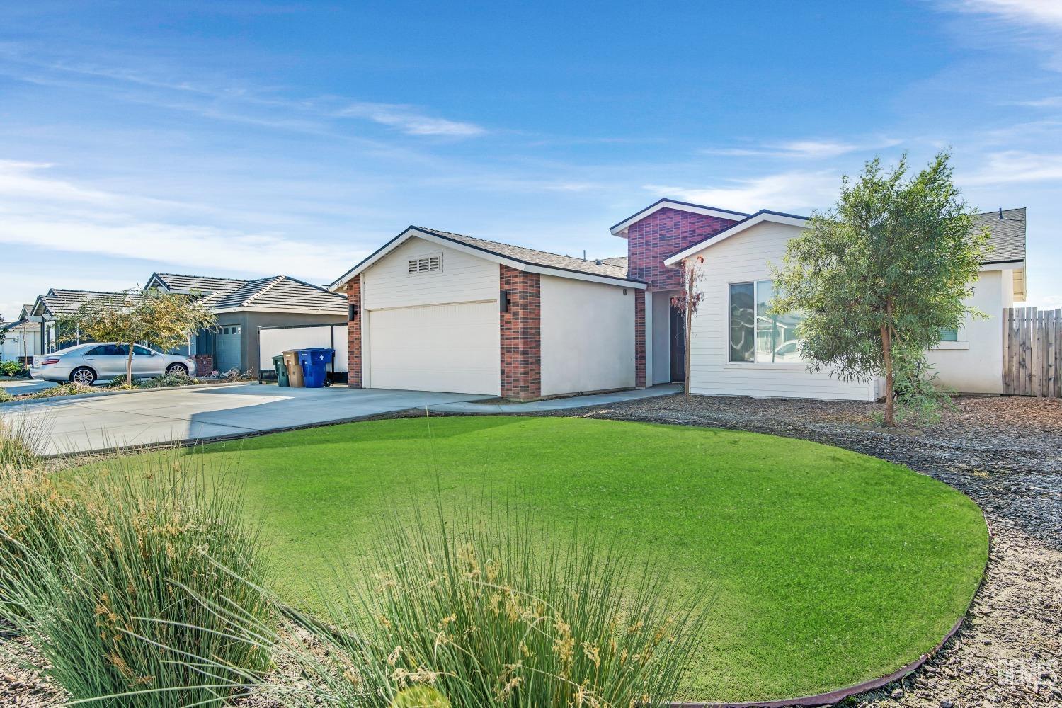 Undisclosed Address Bakersfield, CA 93313 - Photo 4 of 45 a view of a house with a backyard