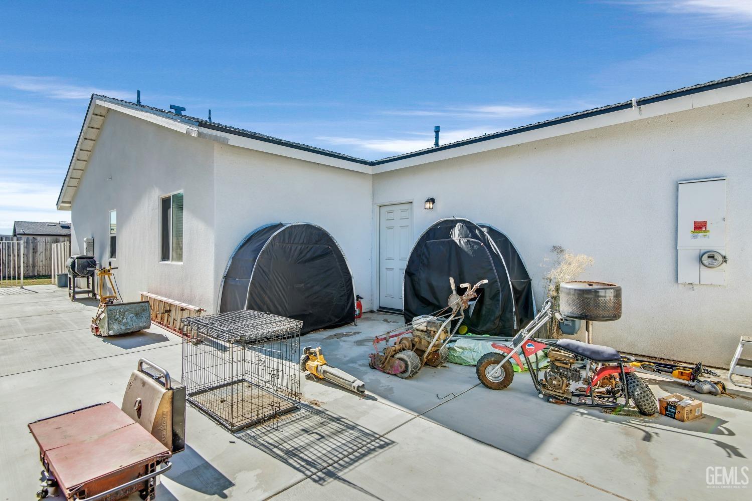 Undisclosed Address Bakersfield, CA 93313 - Photo 42 of 45 a front view of a house with seating