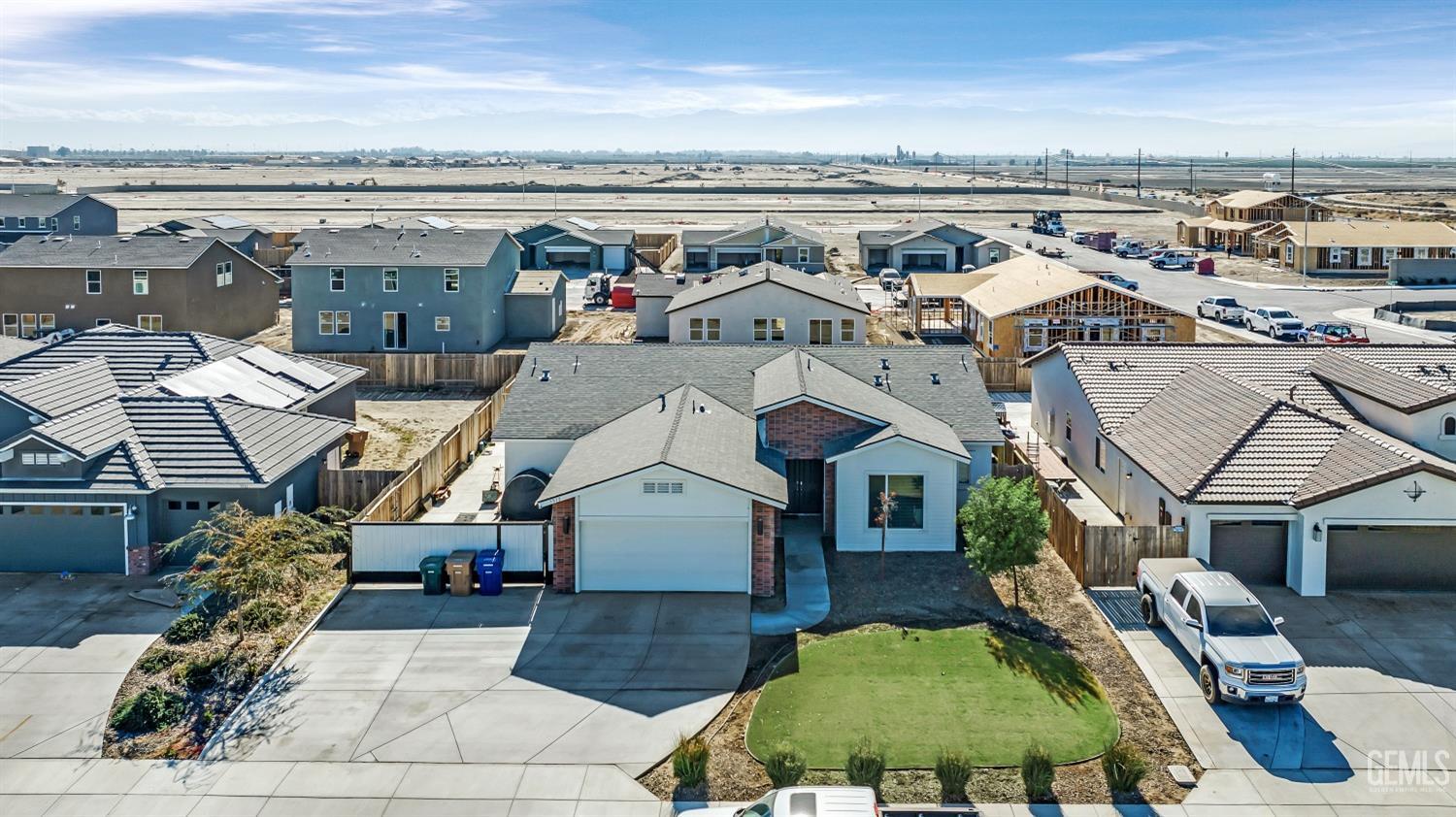 Undisclosed Address Bakersfield, CA 93313 - Photo 44 of 45 an aerial view of a house with swimming pool outdoor seating and mountain view