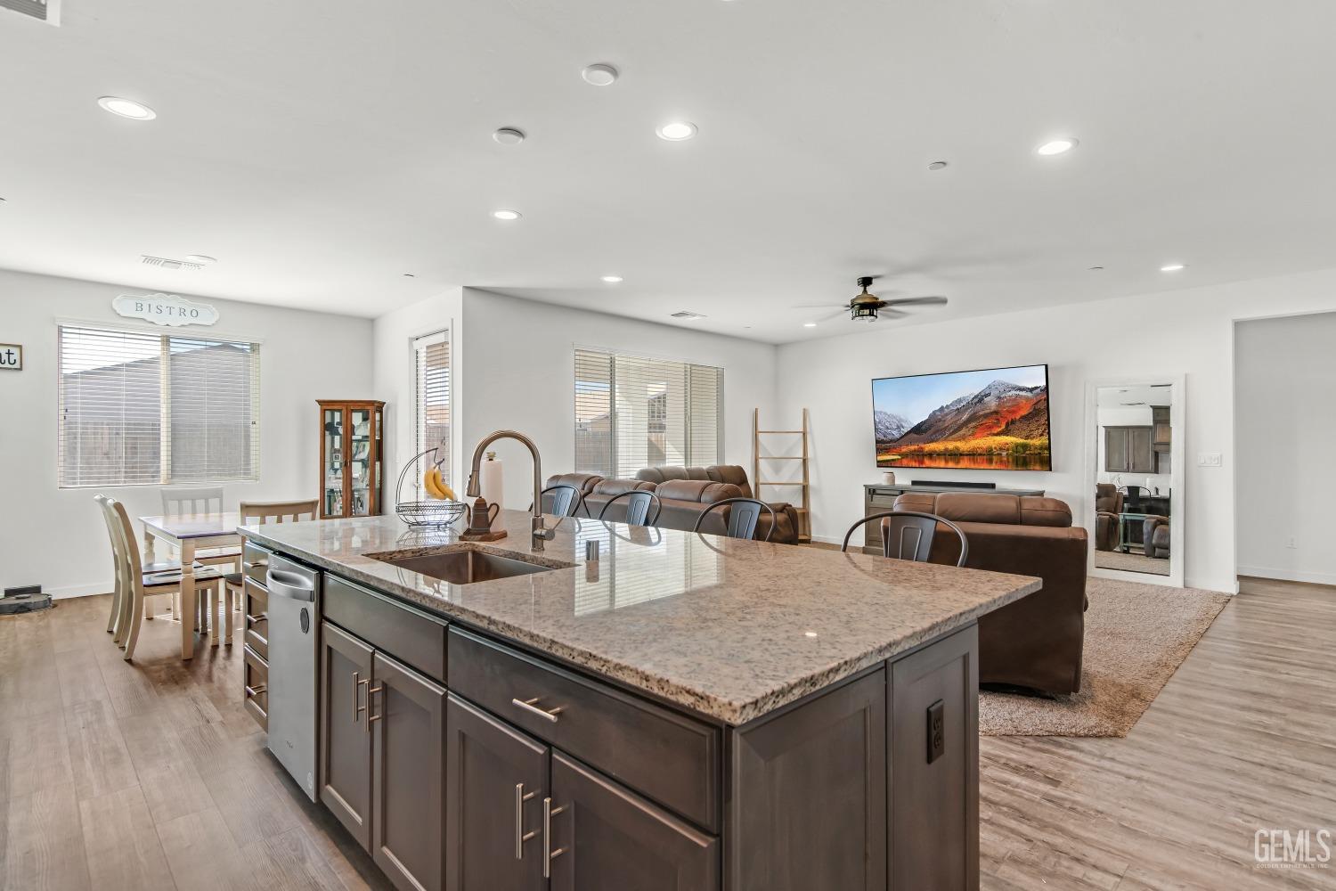 Undisclosed Address Bakersfield, CA 93313 - Photo 6 of 45 a kitchen with stainless steel appliances granite countertop a sink and a microwave