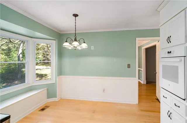 a view of a room with gym equipment and a window