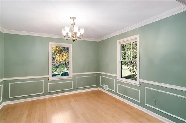 a kitchen with refrigerator and window