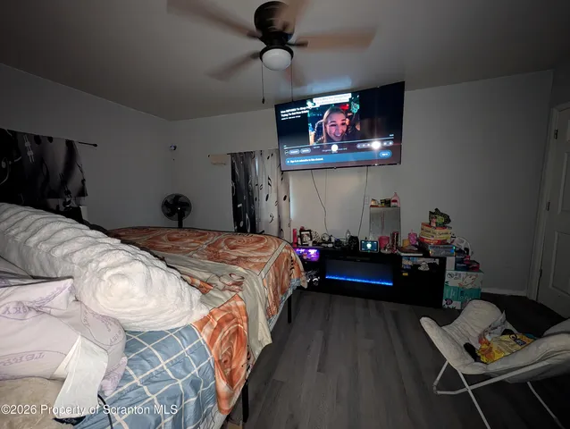 a bed room with a bed window and wall painting