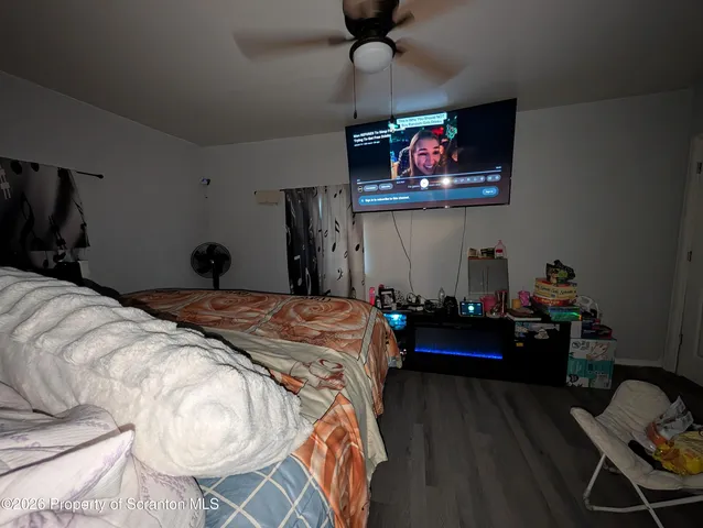 a bedroom with bed and furniture