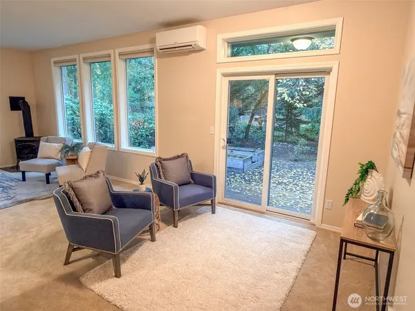 a living room with furniture and a lamp