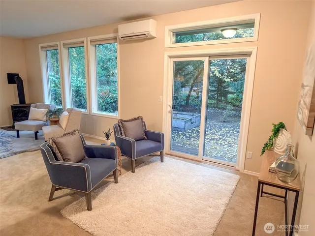 a living room with furniture and a lamp