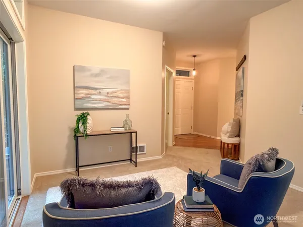 a living room with couches chairs and a coffee table