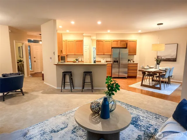 a bedroom with a bed and a lamp next to a window